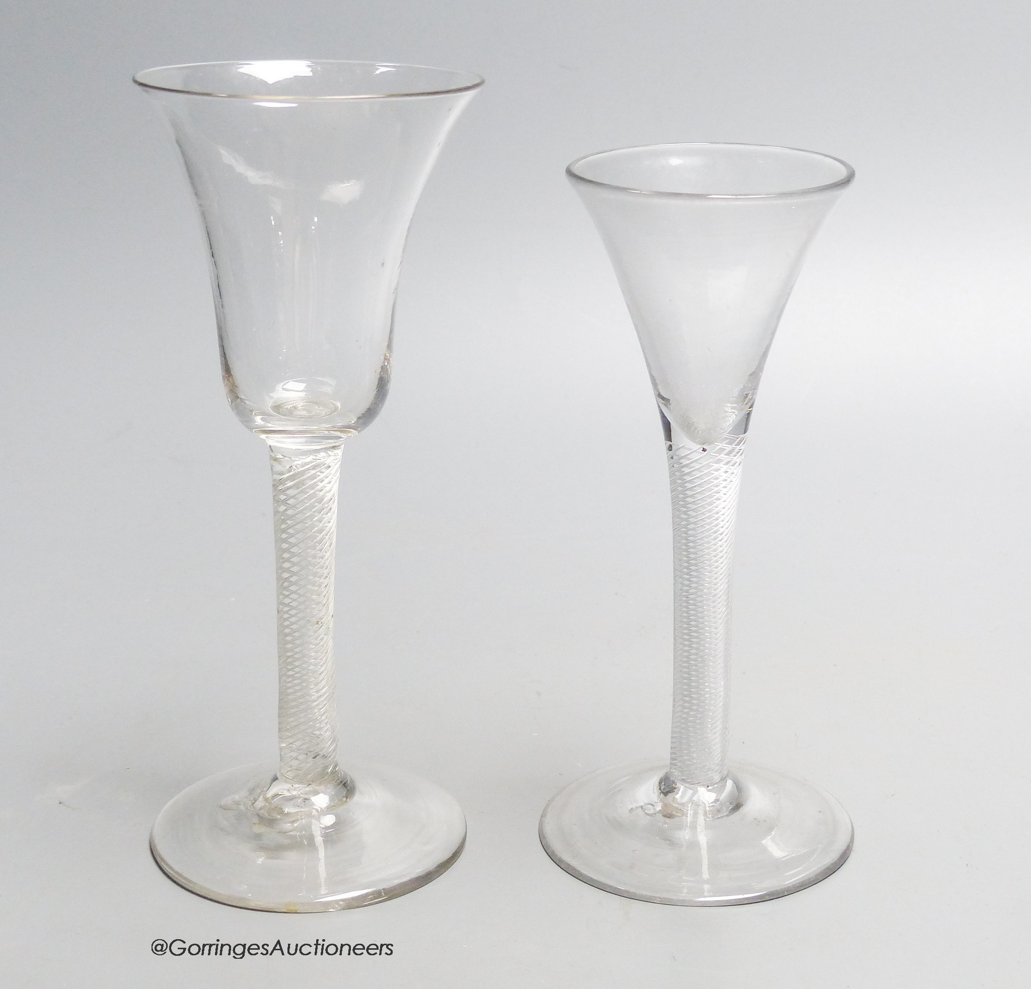 A Georgian air twist stem wine glass and an air twist stem drawn trumpet ale glass, c.1750, tallest 19cm